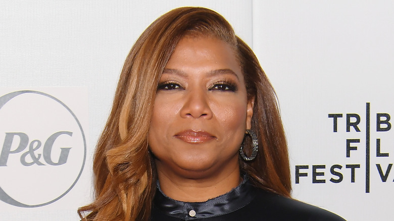 Queen Latifah wearing a silk shirt