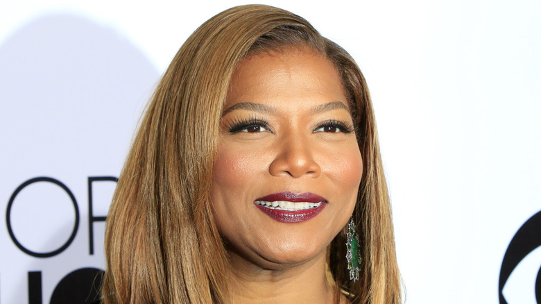 Queen Latifah wearing big earrings