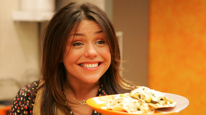 Rachael Ray smiling with plate of food