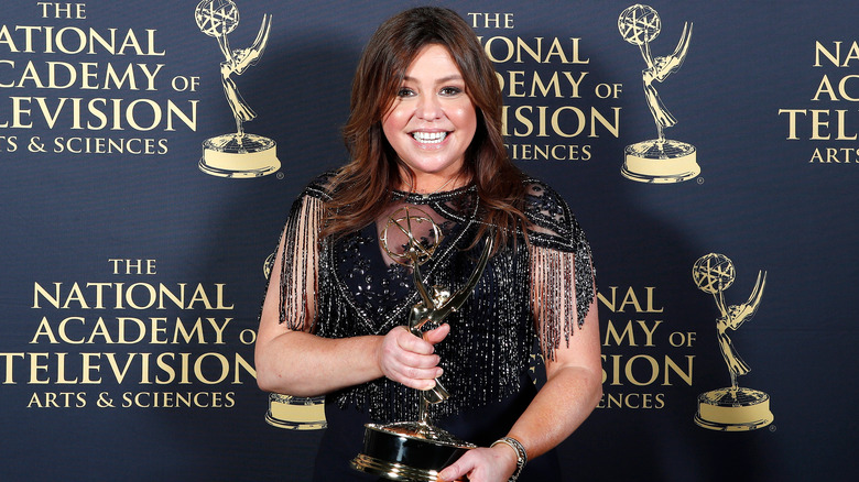 Rachael Ray posing with her Emmy