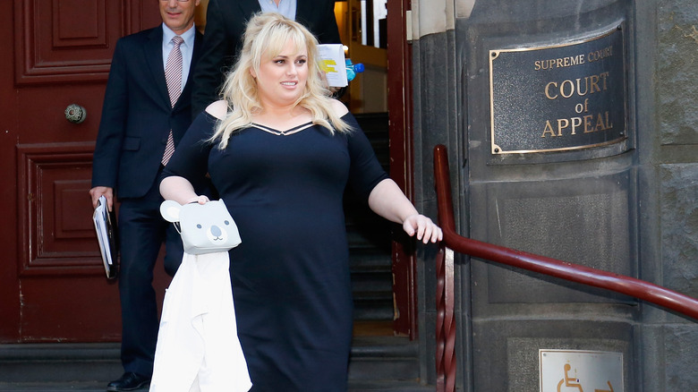 Rebel Wilson exiting a court house 