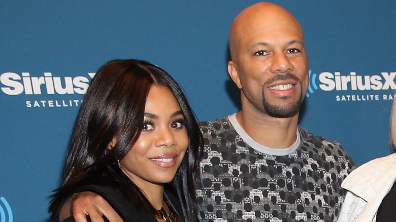 Regina Hall and Common smiling