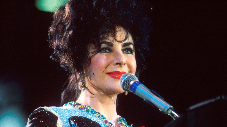 Elizabeth Taylor at a microphone