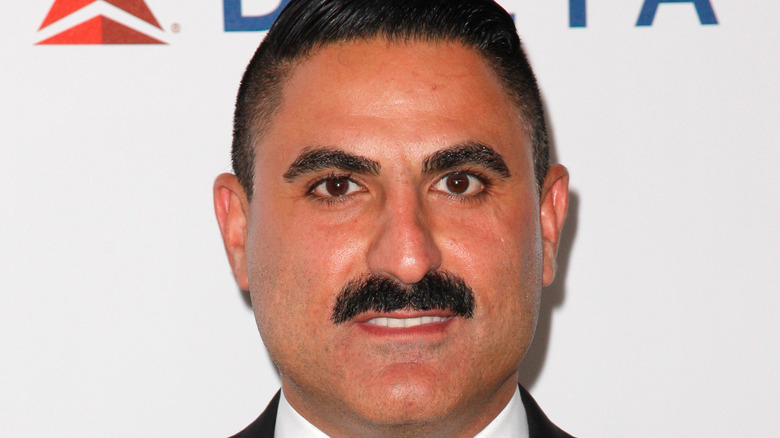 Reza Farahan posing for cameras