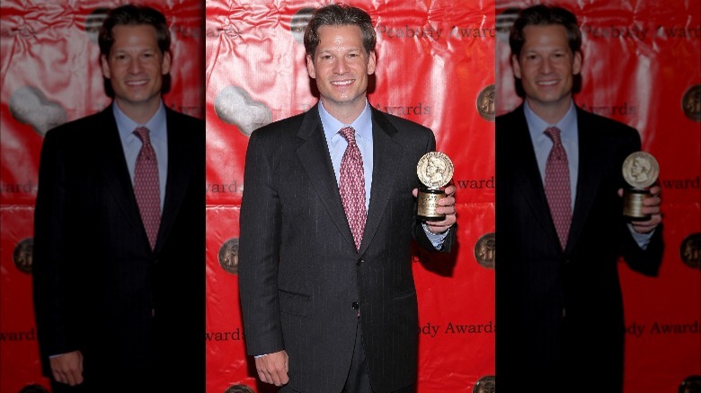 Richard Engel holding an award