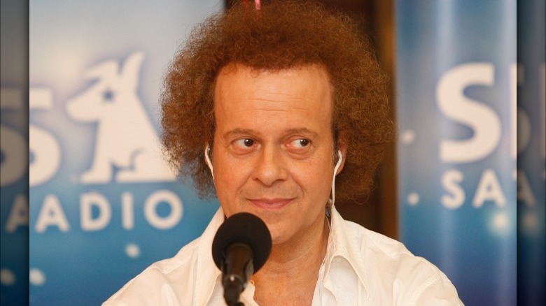 Richard Simmons talking into microphone
