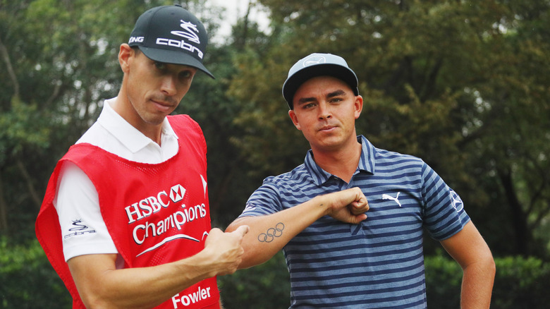 Rickie Fowler showing off his tattoo