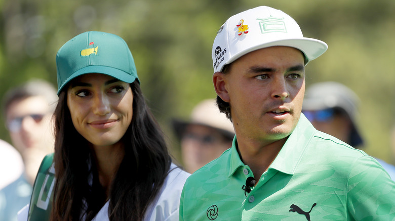 Rickie Fowler and Allison Stokke on a golf course