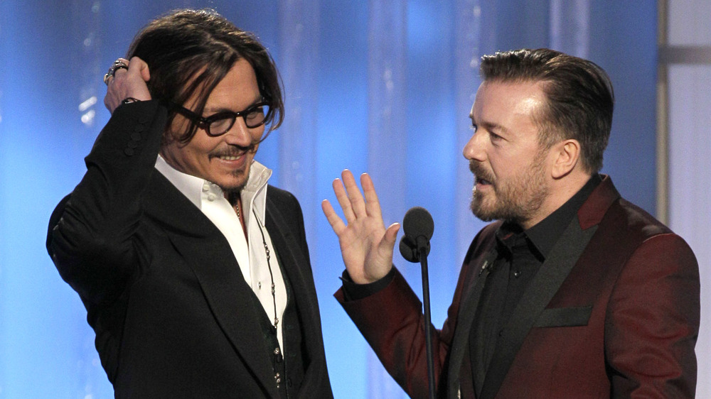 Ricky Gervais and Johnny Depp onstage