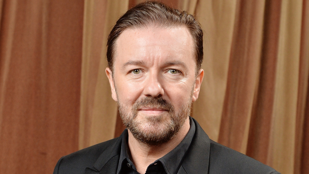 Ricky Gervais with a slight smile