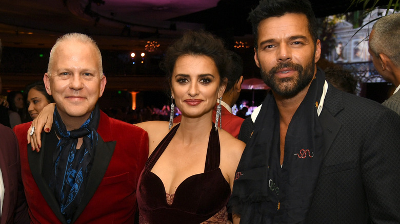 Ricky Martin posing with Ryan Murphy and Penelope Cruz