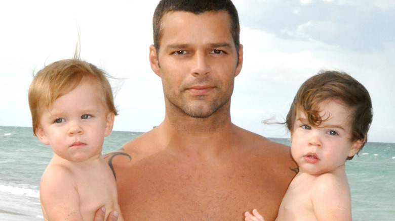 Ricky Martin holding his sons 