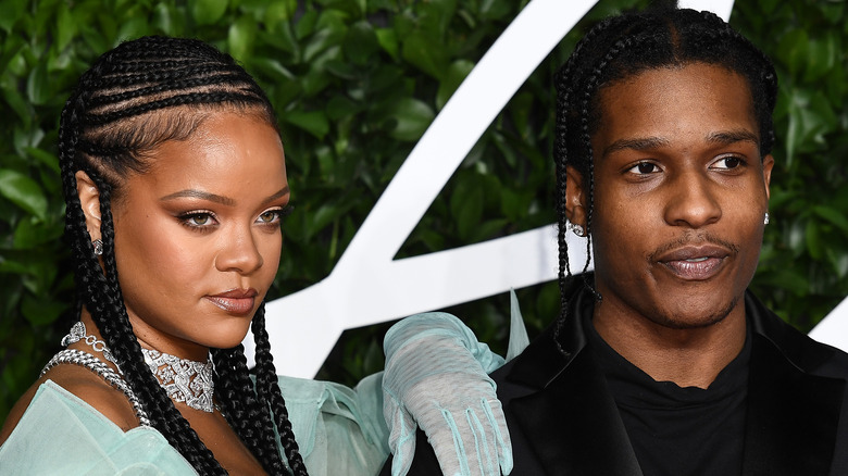 Rihanna putting her hand on A$AP Rocky's shoulder