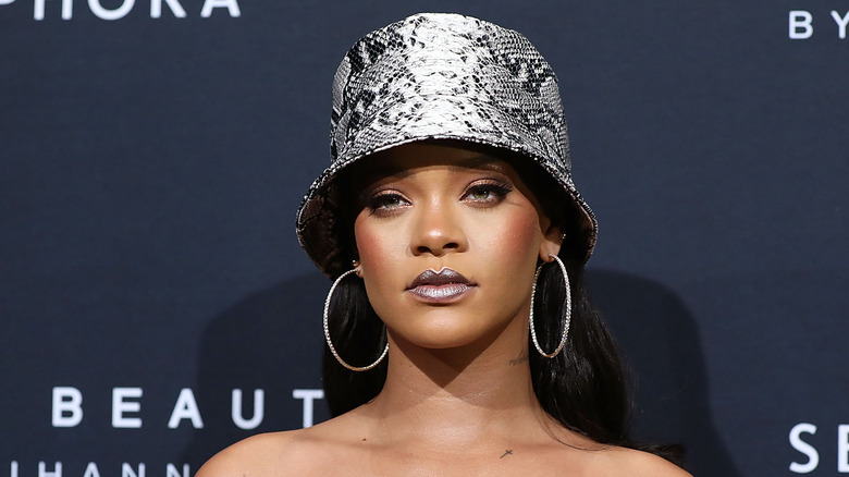 Rihanna in snakeskin hat