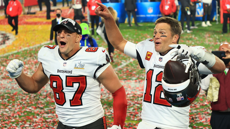 Rob Gronkowski and Tom Brady celebrating on the field