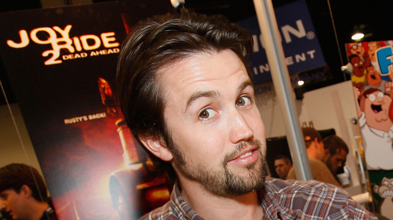 Rob McElhenney signing a poster