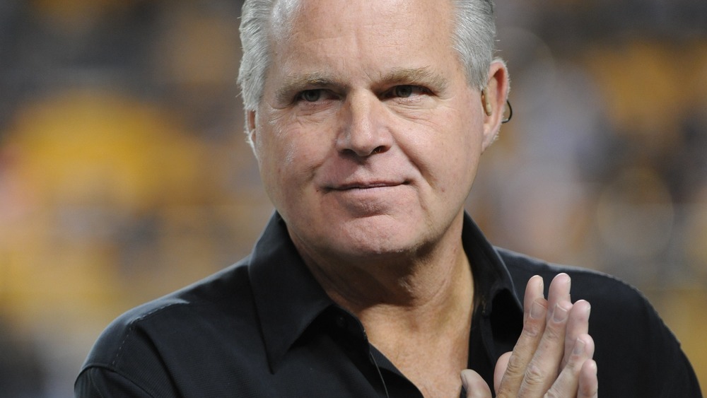 Rush Limbaugh with hands clasped together