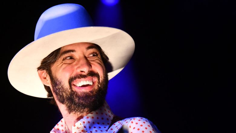 Ryan Bingham with cowboy hat, smiling