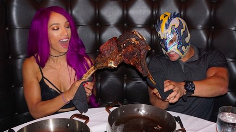 Sasha Banks eating a giant steak