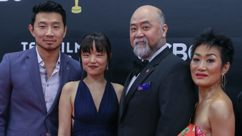 Simu Liu and cast of Kim's Convenience, posing