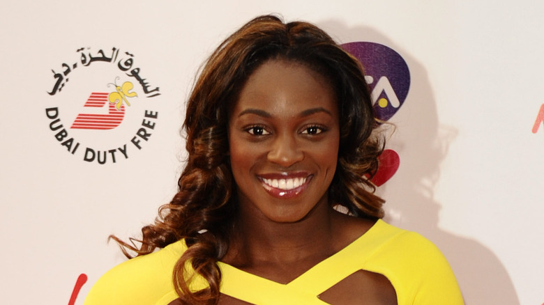 Sloane Stephens in a yellow dress