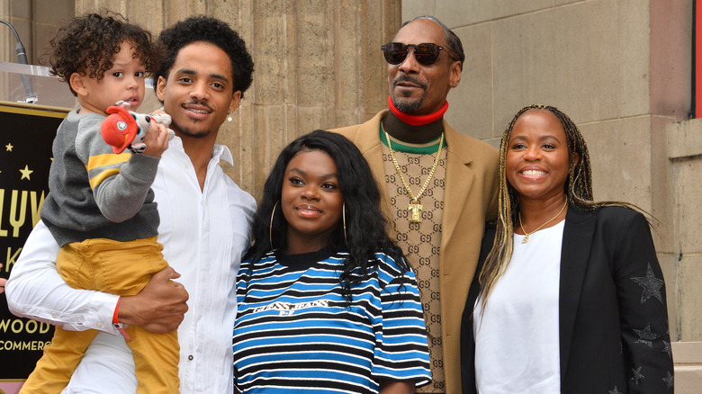 Snoop Dogg, Shante Broadus, Cori Broadus, Corde Broadus, and little Zion smiling together