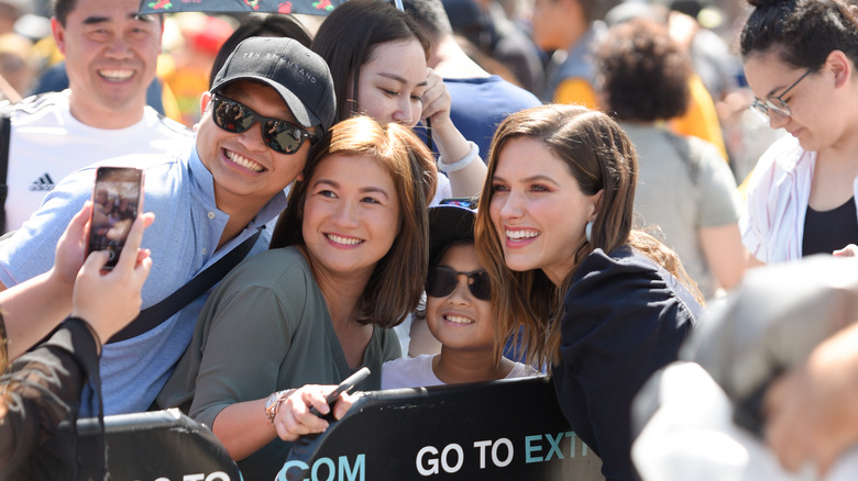 Sophia Bush posing with fans