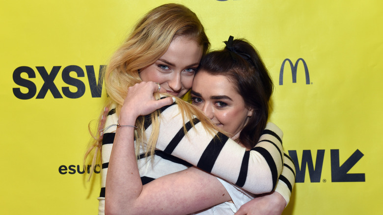 Sophie Turner hugging Maisie Williams on the red carpet