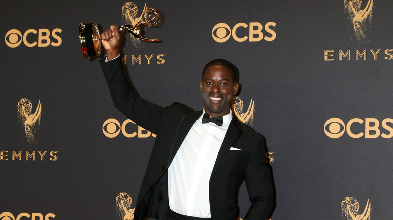 Sterling K. Brown holding an Emmy