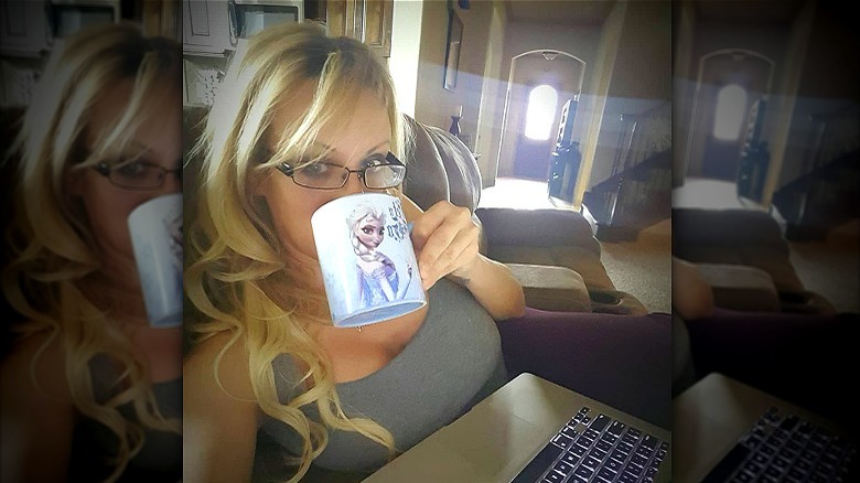 Stormy Daniels drinking from "Frozen" mug