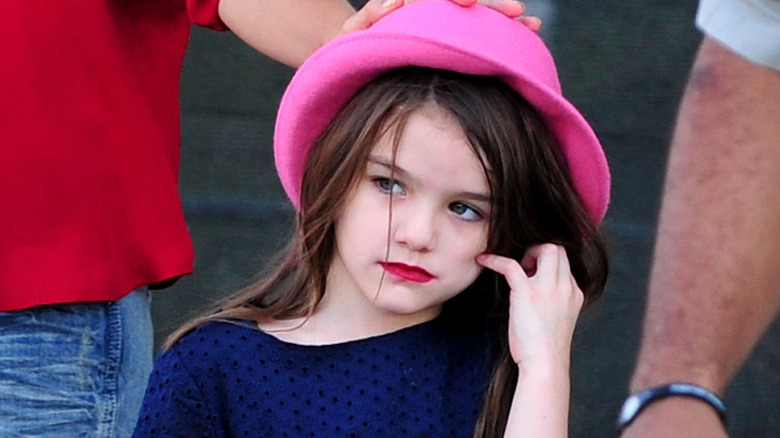 Suri Cruise wearing pink hat