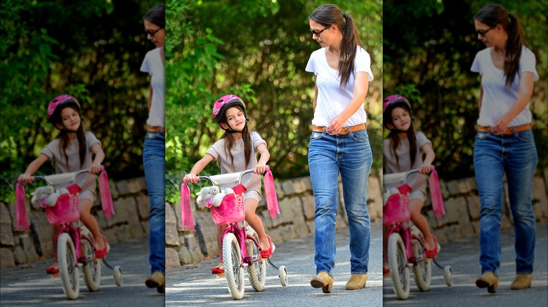 Suri Cruise riding bike