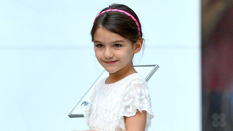 Suri Cruise wearing pink headband