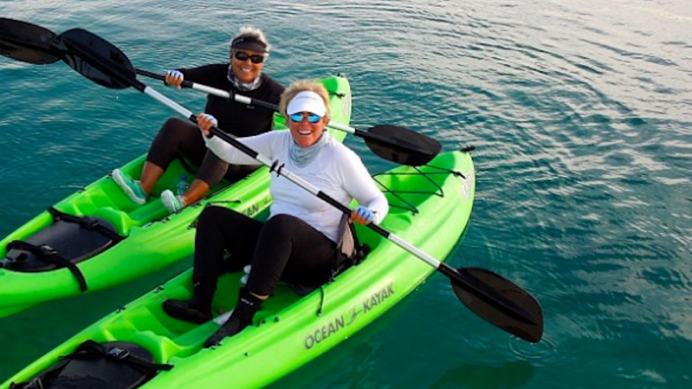 Kathy "KT" Travis and Suze Orman kayaking in the Bahamas