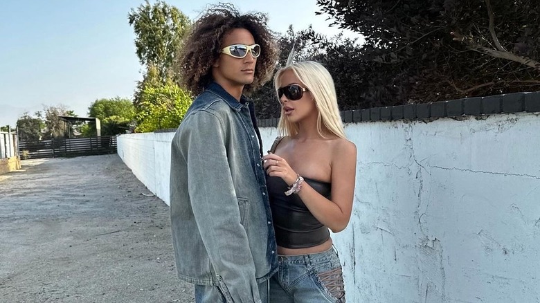 Tana Mongeau, posing with her boyfriend Mokoa