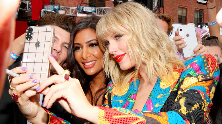 Taylor Swift taking a selfie