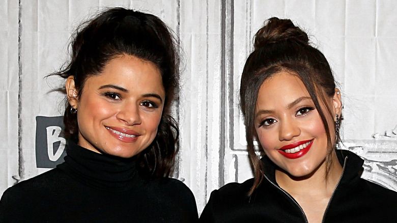 Melonie Diaz and Sarah Jeffery smiling