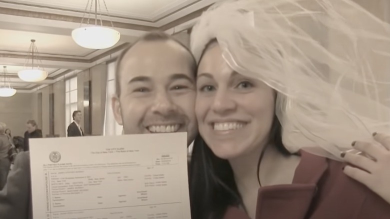 James Murray and Jenna Vulcano with their marriage certificate