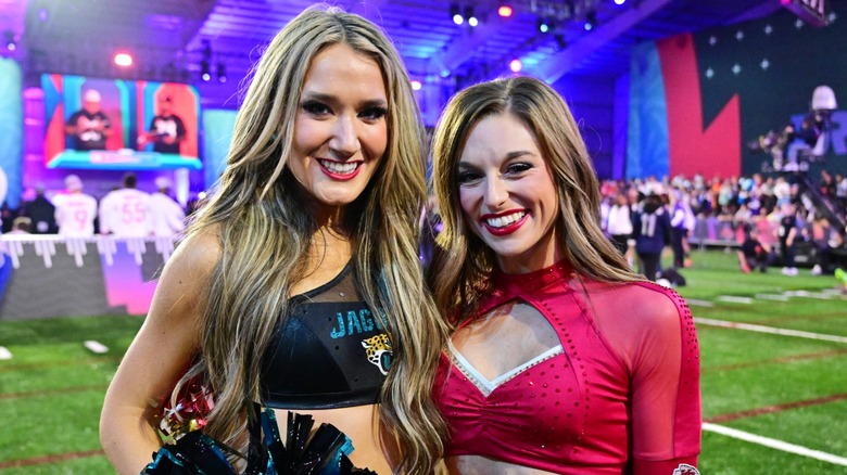 A Kansas City Chiefs cheerleader poses with a Jacksonville Jaguars cheerleader at the Pro Bowl