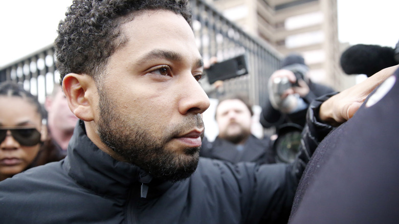 Jussie Smollett wading through photographers