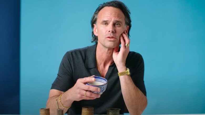 Walton Goggins with his collection of sand