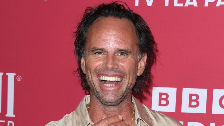 Walton Goggins smiling while attending BAFTA Tea Party