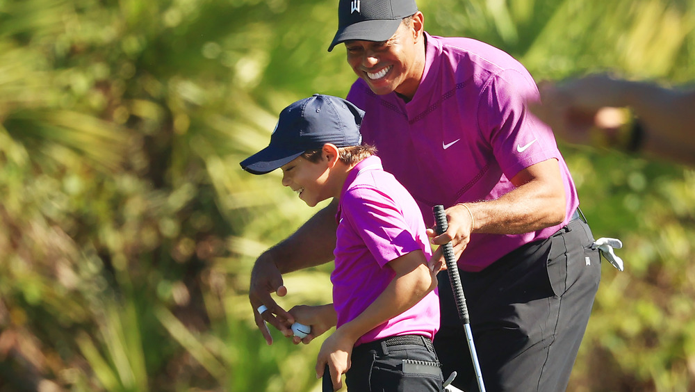 Charlie Woods and Tiger Woods smiling