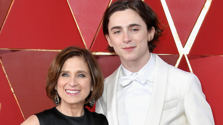 Nicole Flender and son Timothee Chalamet posing