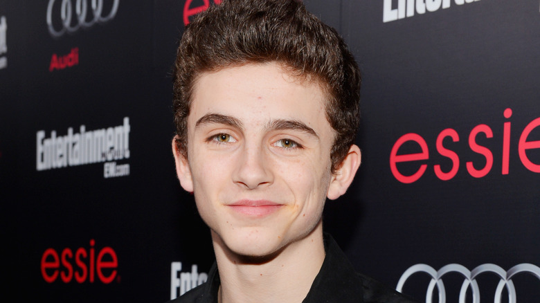 Timothee Chalamet grinning