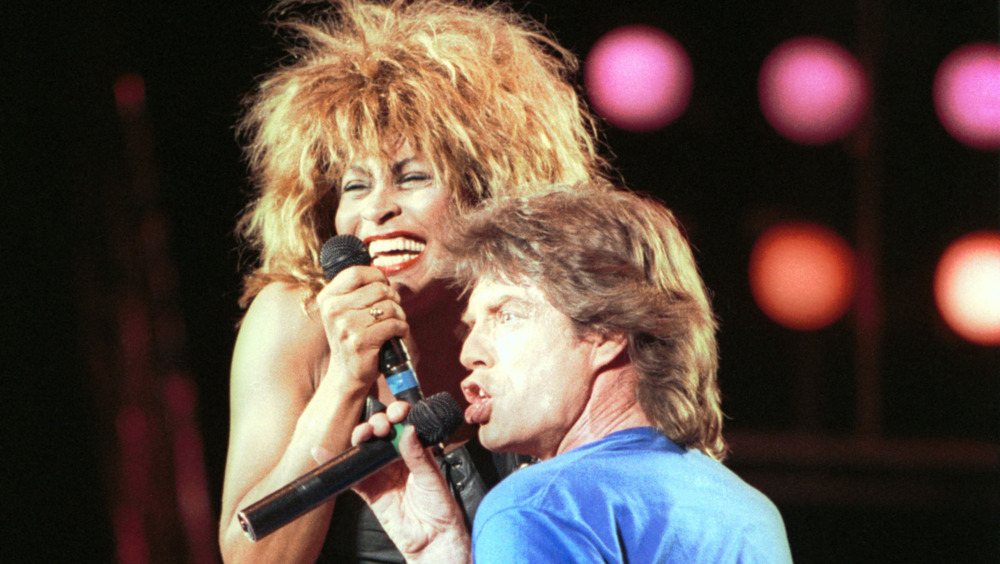 Tina Turner and Mick Jagger on stage