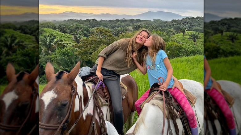 Vivian and Gisele Bündchen ride horses together