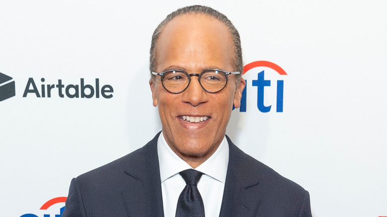 Lester Holt posing for cameras