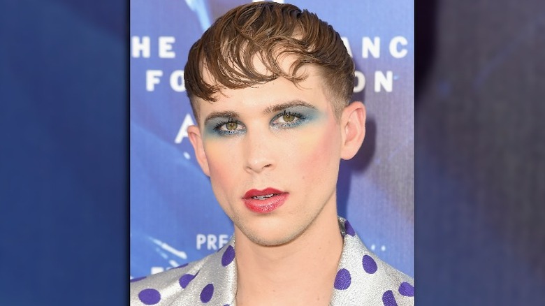 Tommy Dorfman with blue eyemakeup