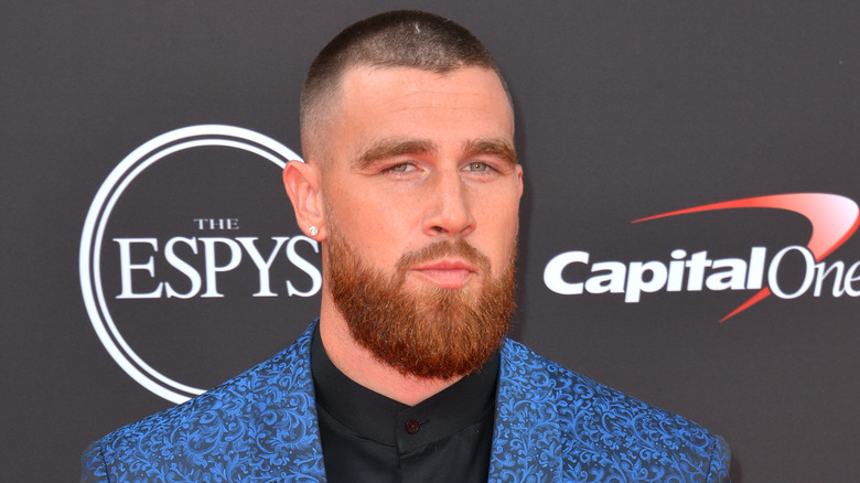 Travis Kelce dressed in a suit